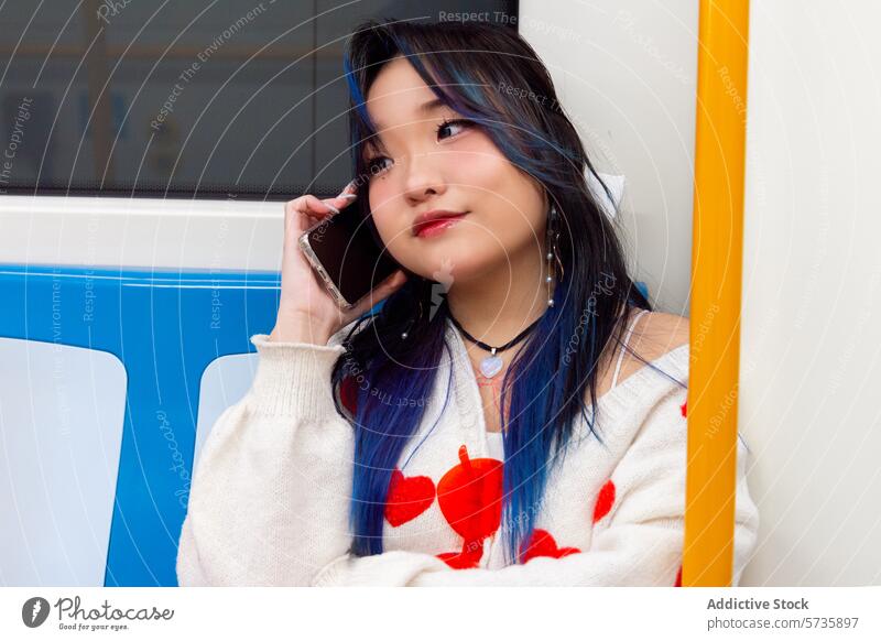 Gen Z Chinese Girl Chatting on Phone in Subway girl smartphone subway blue hair modern lifestyle young woman talking public transport trendy fashion technology