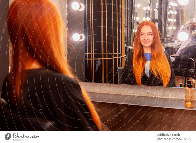 Young woman admiring her hairstyle in salon mirror hair salon ginger hair reflection light bulb young smiling beauty sitting grooming haircare stylist elegance