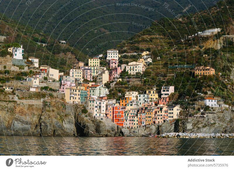 Colorful hillside houses by the sea in Cinque Terre cinque terre italy architecture colorful vibrant coastal village mediterranean building waterfront landscape