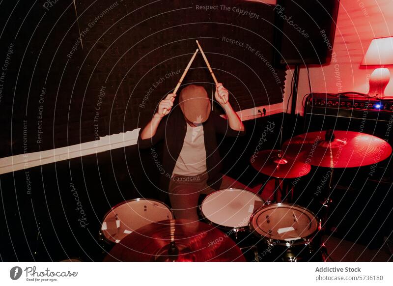 Unrecognizable male drummer performing on studio with enthusiasm drumstick cymbal snare tom-tom hi-hat performance music band playing instrument rhythm beat kit