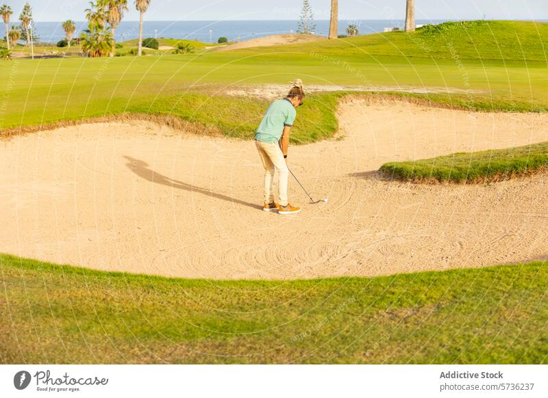 Unique golfer with dreadlocks playing in a sand bunker blonde swing golf course sunny golfing attire style unique untraditional green grass outdoor sport