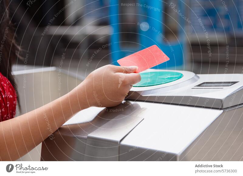 Person using contactless card at subway entrance person hand validator gate public transport commute technology ticket travel passenger convenience electronic