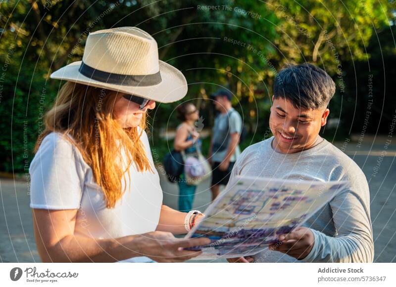 Young travelers consulting a map in a sunny park consultation young adult conversation outdoor tree fellow traveler engaging discussing directional navigation