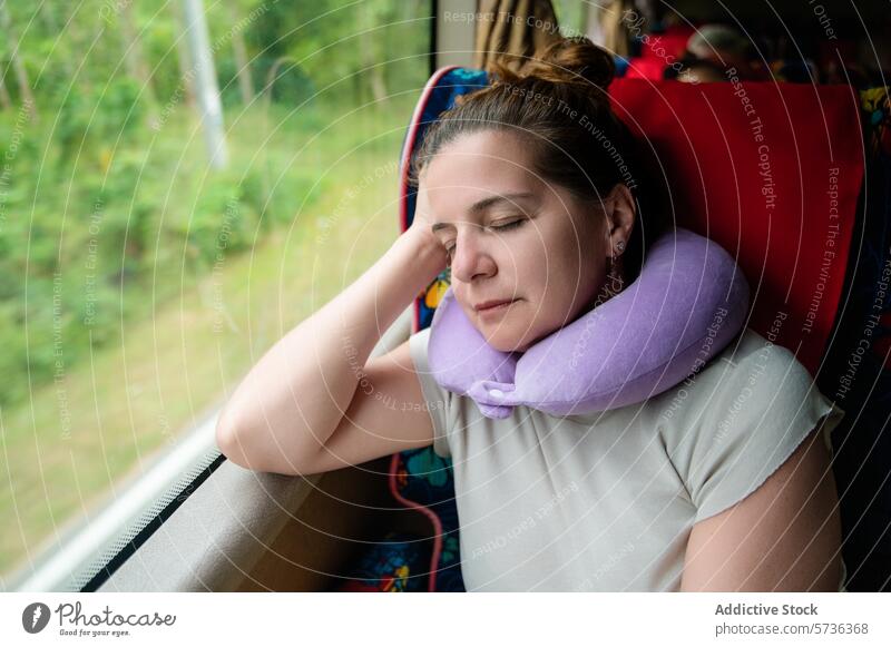 Comfortable sleep on a bus journey with neck pillow woman travel accessory restful seated moving convenience comfort passenger transportation public transit