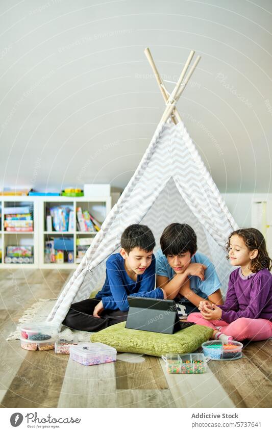 Children Engaged in Creative Play with Beads and Tablet children play tablet hama beads crafting pixel art creative indoor floor teepee colorful diy