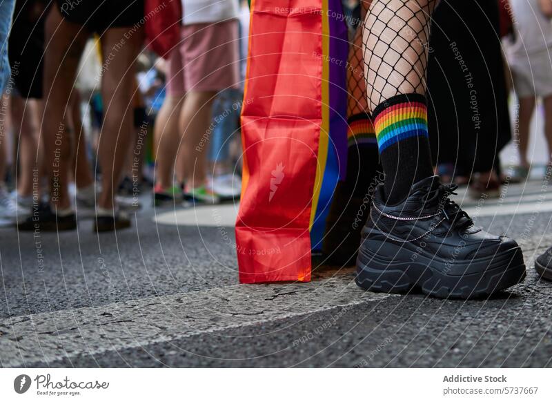 Diverse Legs and Rainbow Socks at Pride March lgbtiq pride rainbow flag socks march celebration solidarity diversity street ground-level walking colorful parade