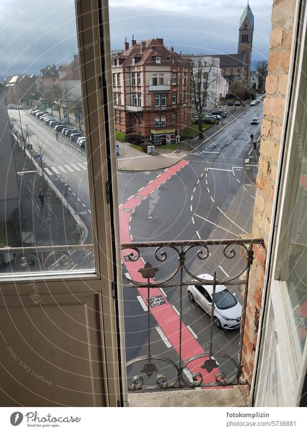 Window view of road junction with cycle path Street Crossroads Road traffic Cycle path Transport Lane markings Traffic infrastructure Direction Orientation