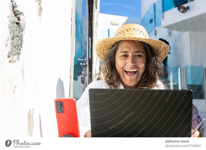 Joyful digital nomad working on laptop outdoors woman sunny coastal cheerful online business freelance remote job technology internet mobile professional travel