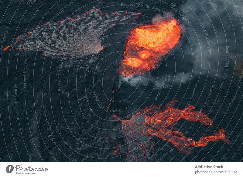 Aerial view of molten lava flow in Icelandic landscape aerial icelandic terrain earth heat smoke geology volcanic eruption magma nature natural disaster