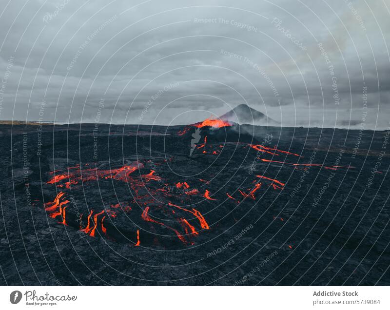 Molten Lava Flowing Through Icelandic Volcanic Landscape iceland volcano lava landscape molten flow geology nature eruption volcanic terrain plume smoke