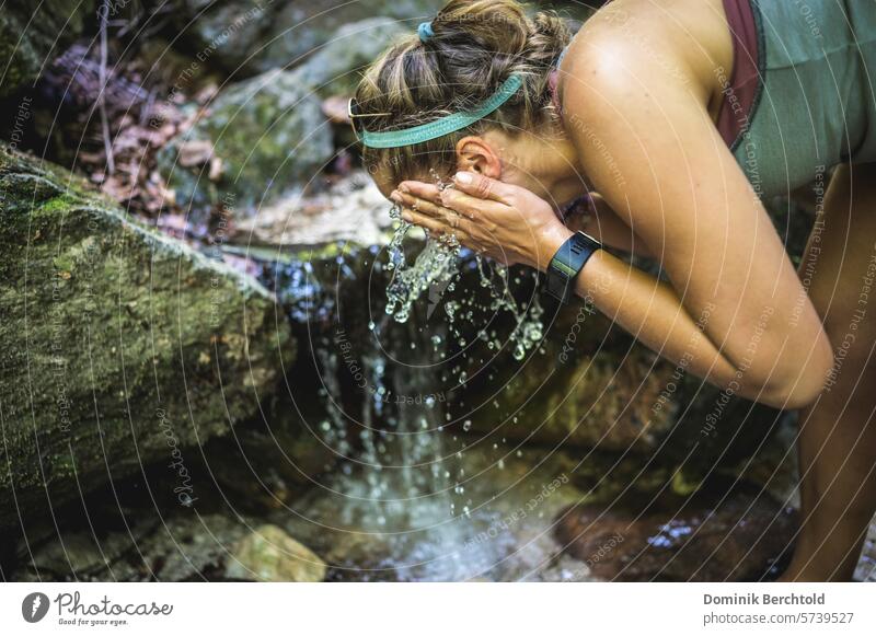 Woman cools off in a Gebrigsbach stream Hiking Brook River Body of water cooling Water Wet Summer perspire Refreshment Kneipp Kneipp cure Cold Nature Flow