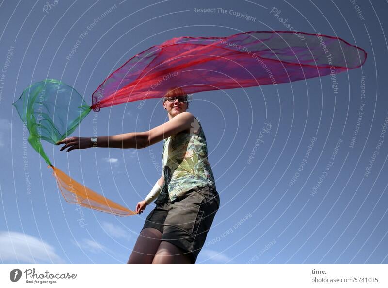 Woman with flying scarves cloths Rag Acrobatics Sports Movement Art Sky Clouds Arm Shirt Shorts Dynamics Joy Flying Hover Summer Freedom Funsport