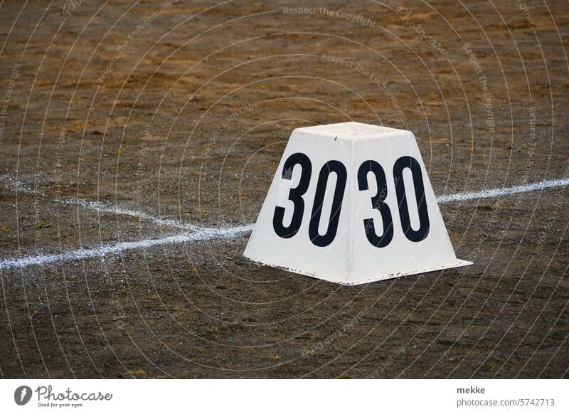 The 30th as a target number Digits and numbers Signs and labeling digit White Numbers wide Day Throw litter Sports Sporting grounds ash ash pit javelin Discus