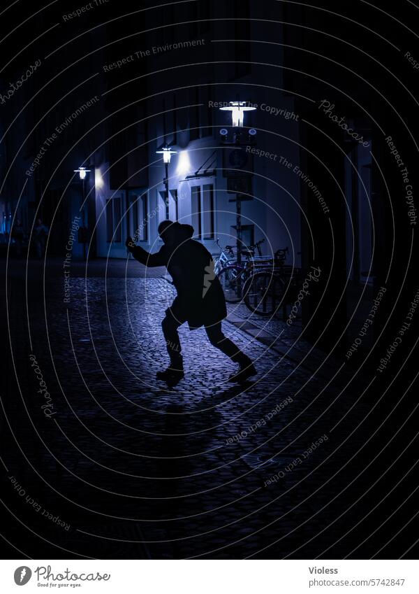 At night in Hildesheim Dark lane cobblestones roguish streetlamp Silhouette Blue criminal Crime scene ghostly