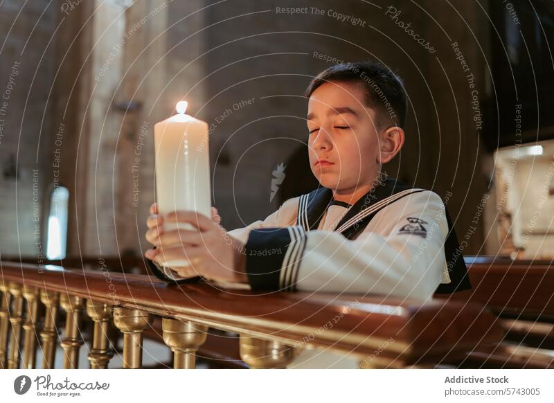 A thoughtful boy holds a lit candle during his First Communion, reflecting in a serene church setting reflection prayer faith Christian ceremony worship