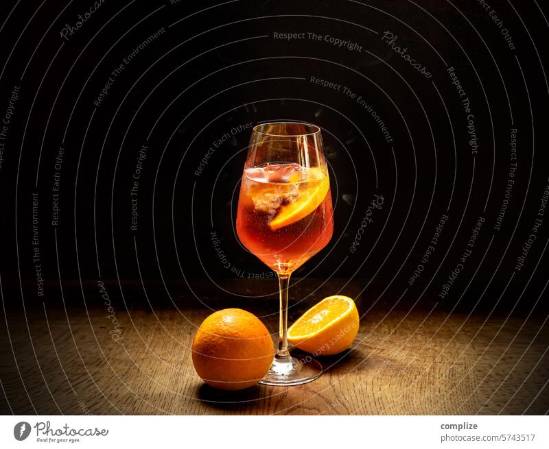 Italian summer drink with 12 letters aperol Aperol Spritz Orange Ice Summer Vine Prosecco Orange slice Bar Roadhouse Restaurant Wine glass Ice cube Cocktail