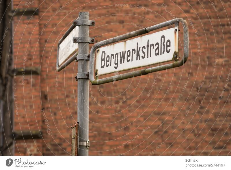 Once upon a time, street sign Bergwerkstraße and red brick wall in the background Mine road Brick wall Brick-built house Pit settlement colliery