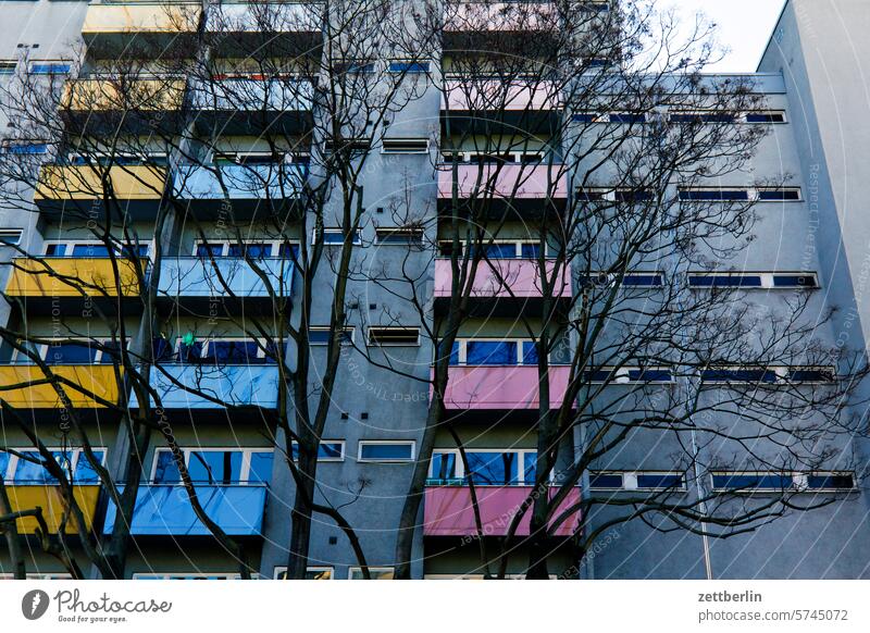 New building block with colorful balconies on the outside Fire wall Facade Window House (Residential Structure) Sky Sky blue rear building Backyard Courtyard