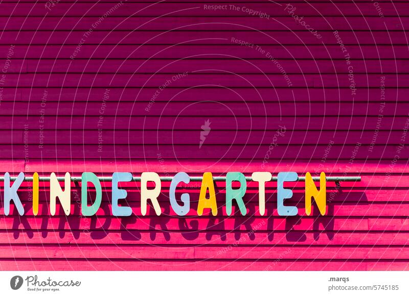 kindergarten Kindergarten Characters Letters (alphabet) Facade Stripe Child childcare nursery kita Infancy Parenting Multicoloured Pink Wooden wall Light Shadow