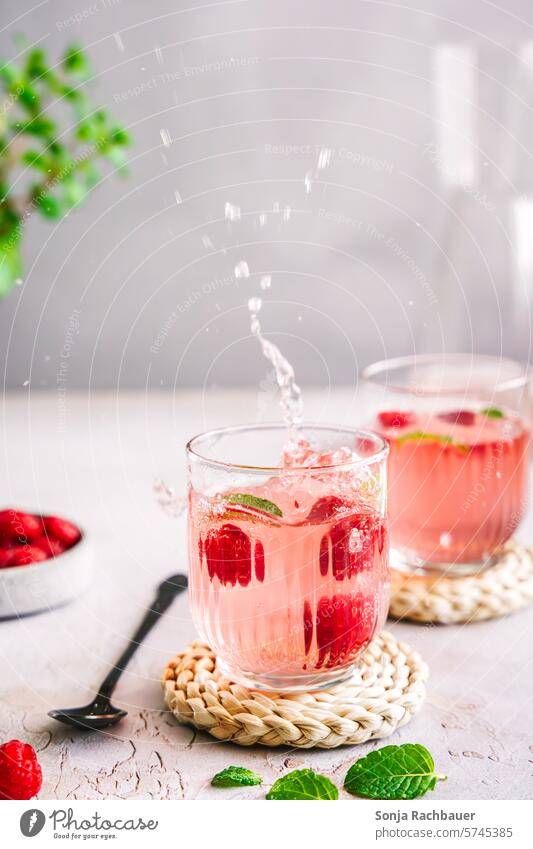 Sparkling refreshing drink with raspberries on a gray table Beverage Inject Raspberry Cold Summer Glass Fresh Refreshment cute Juice Delicious Soda Soda Water