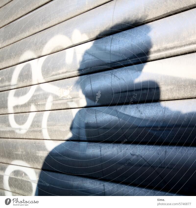 Silhouette on Venetian blind Venetian blinds roller shutter sunny graffiti gleam Perspective angles Facade