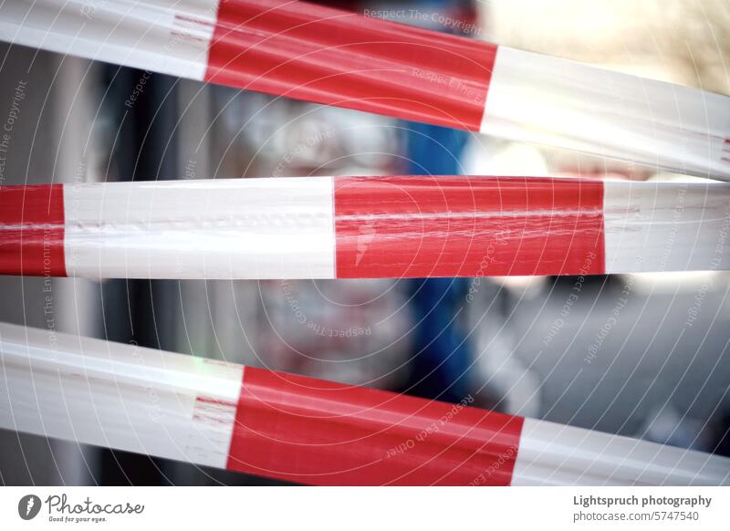 Area closed with bright red and white barricade tape. Horizontal image with selective focus. white color accessibility accessibility sign adhesive tape advice
