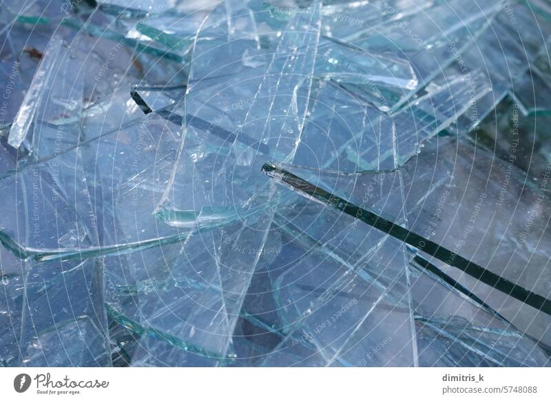 shards of glass transparent broken pieces abstract material background shattered sharp waste recycling texture close up macro fragments smashed cracked grungy