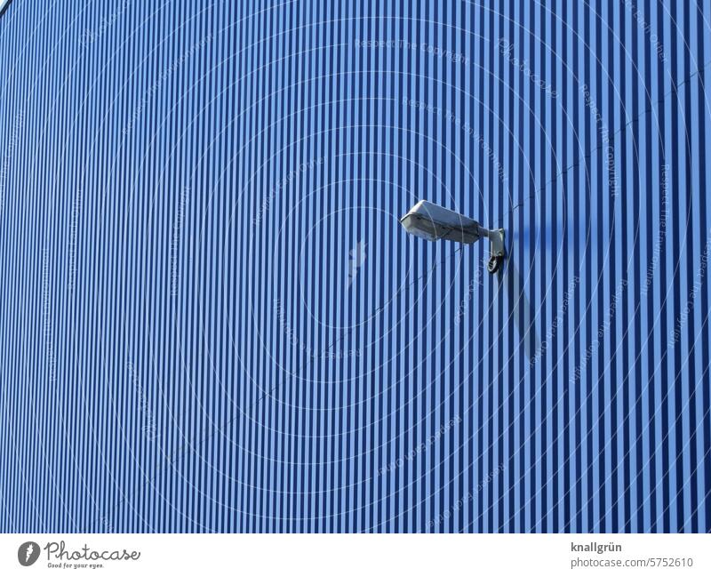 Exterior lighting on a blue slatted façade Lighting Structures and shapes Blue slats Building Architecture Wall (building) Exterior shot Pattern