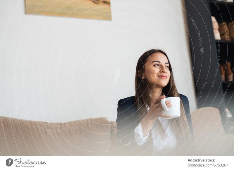 Woman Enjoying a Peaceful Coffee Break at Home woman coffee home sofa smile tranquility comfort break peaceful sipping relaxed content beverage cup morning