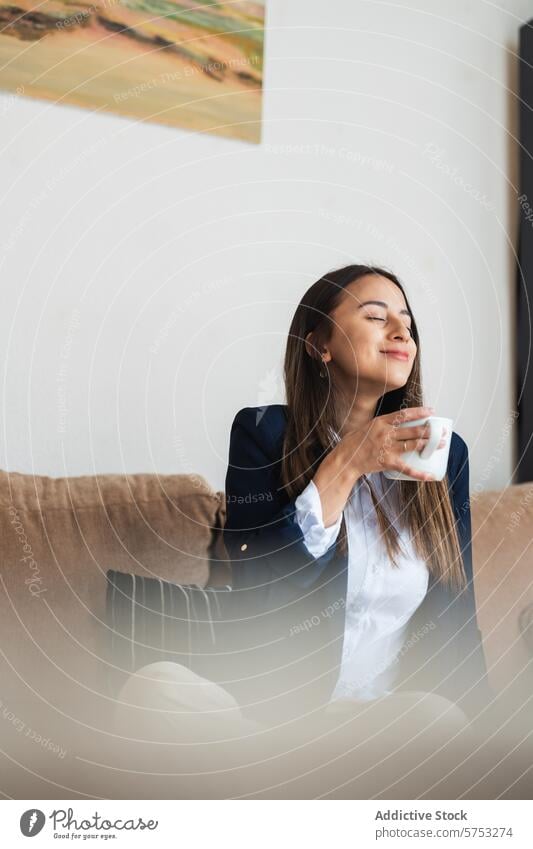 Relaxing moment with a warm cup of coffee woman business suit relaxing peaceful eyes closed serene beverage hot drink cozy enjoyment break tranquility pleasure