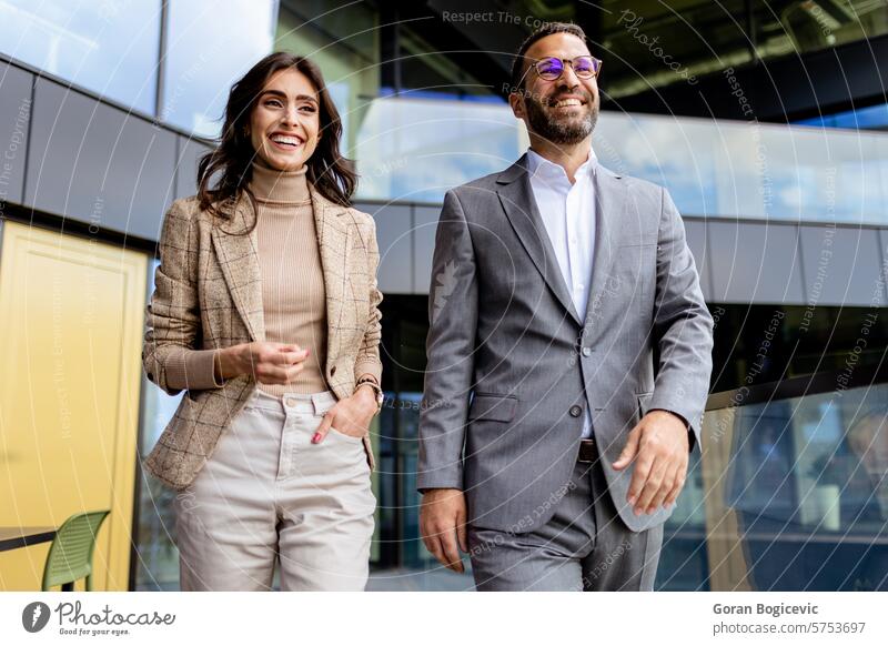 Cheerful Colleagues Exiting a Modern Office Building on a Bright Afternoon. Generative AI after architecture attire building business business people casual