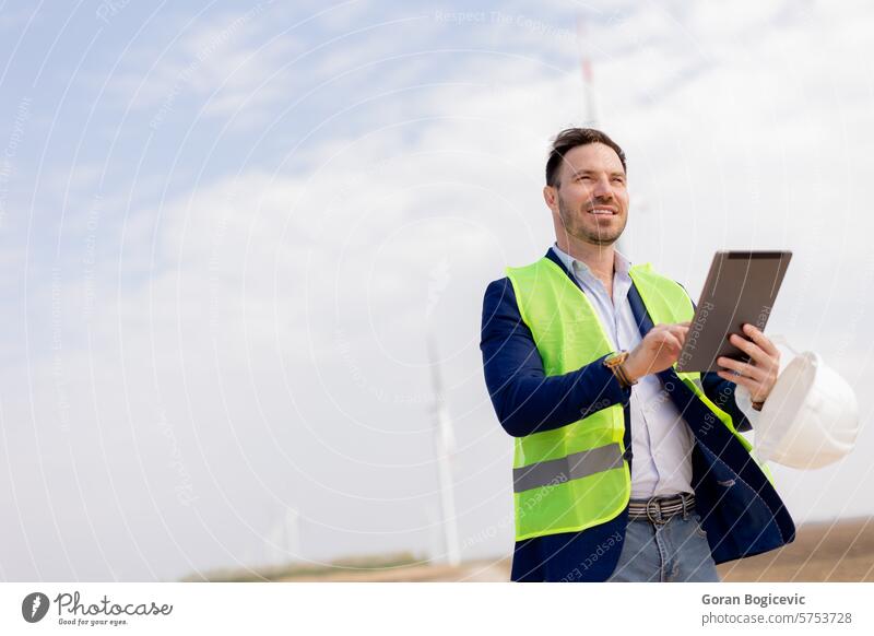 Confident Engineer Overseeing Renewable Energy Project at Wind Farm career confident construction development eco-friendly energy engineer environment executive