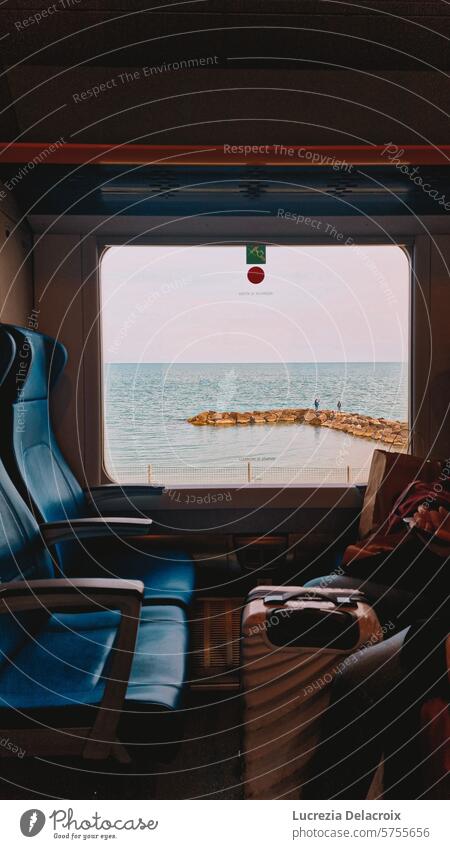 The sea from a train window Train travel Window Ocean people Trip melancholy Poetic Think Seat Waves vacation Transport Vacation & Travel Public transit