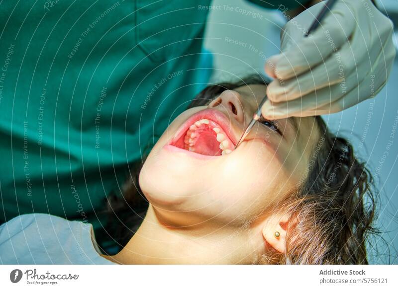 An engaged dentist conducts a routine dental check-up on a young patient, showcasing the standard of pediatric oral care child appointment healthcare