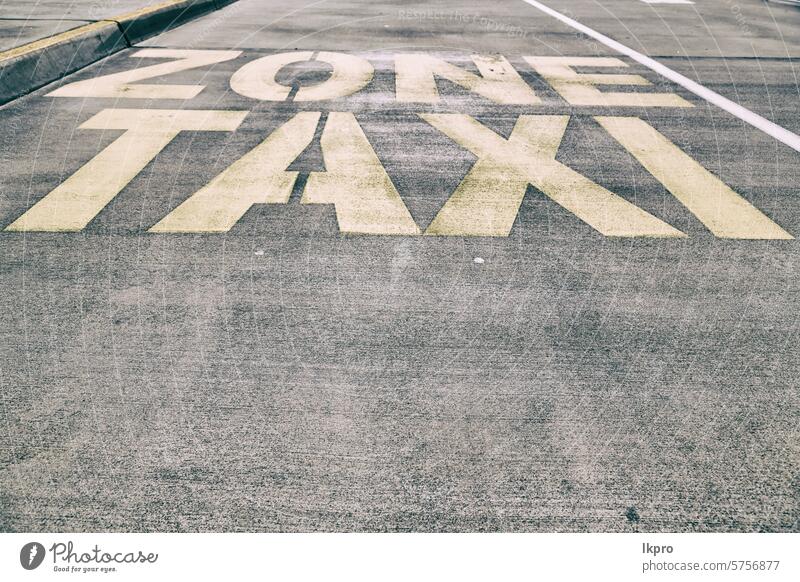 the line painted  in the asphalt for    taxy zone taxi sign road information traffic background transport signal urban symbol street city mark yellow concept