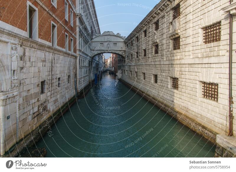 Small canal passing towards famous Bridge of Sighs or Ponte dei Sospiri, Venice, Veneto, Italy bridge venice italy landmark tourism architecture sighs european
