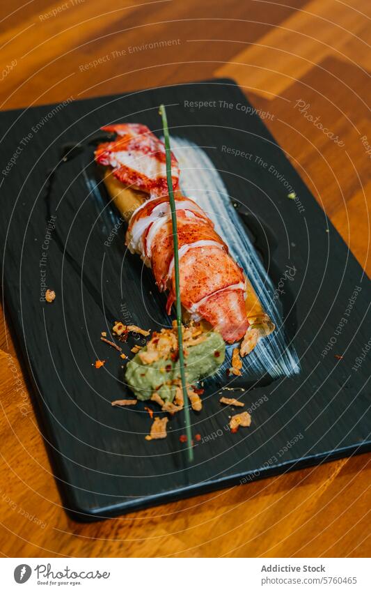 A succulent lobster tail is elegantly plated with artistic garnishes on a slate board, showcasing gastronomic finesse culinary presentation gastronomy cuisine