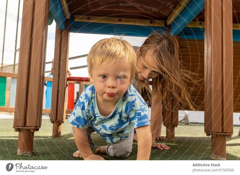 Family Playtime at the Playground with Down Syndrome Child family down syndrome child playground outdoor toddler girl bonding inclusivity fun structure activity