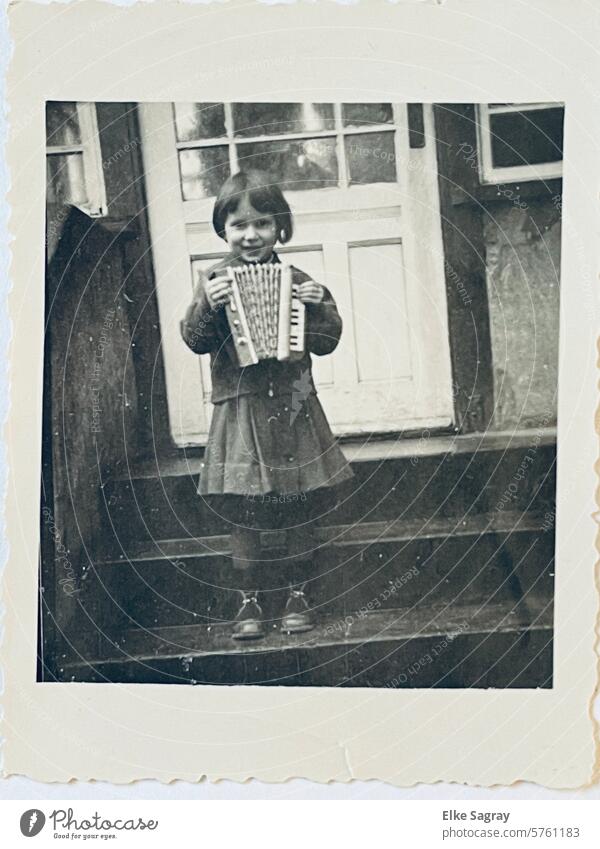 old child photo girl with accordion Black & white photo Analog Exterior shot B/W Girl Portrait of a young girl black-and-white Infancy Family Photography 50s