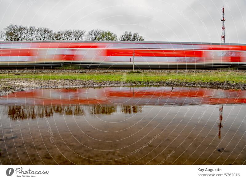 Mirror effect Colour photo Exterior shot Experimental Deserted Water reflection Puddle Rain puddle Puddles photography Track puddle photo Train services
