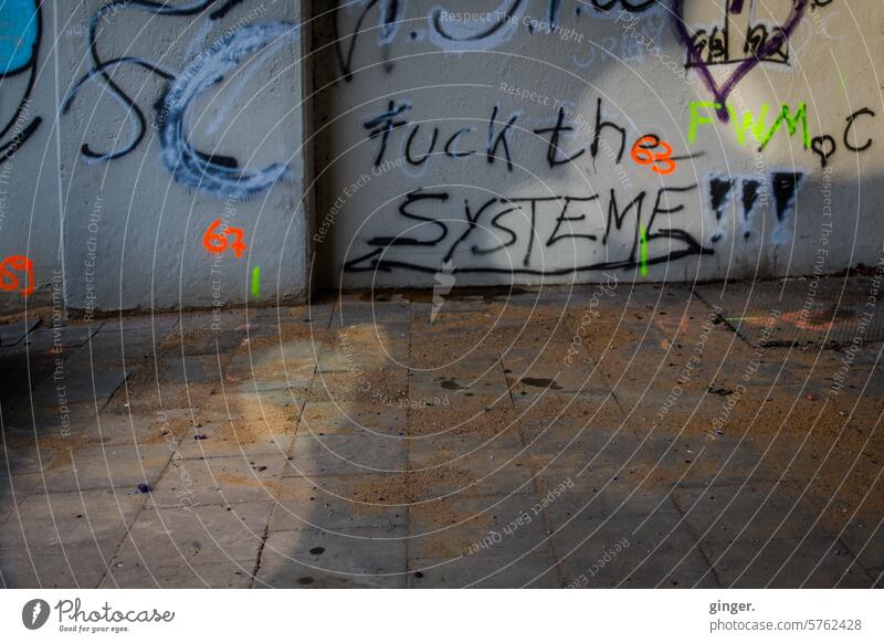 Denglish - Fuck the systems!!! - Graffiti Wall (building) Black Gray variegated frowzy filth lines Dirty dirt Old Transience Ravages of time Change Decline