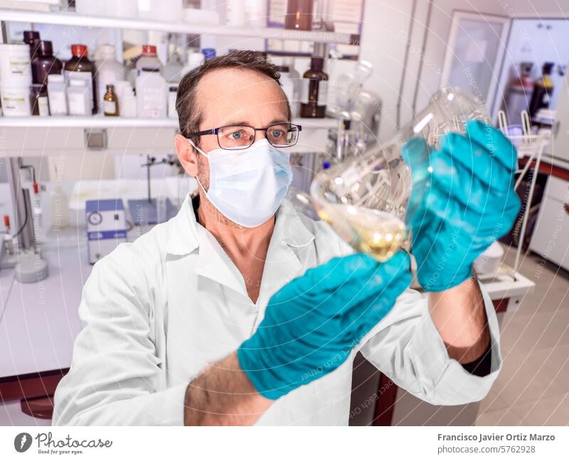 Man scientist working at the laboratory. Selective focus. science research chemistry man experiment medical medicine chemical discovery one person lab coat