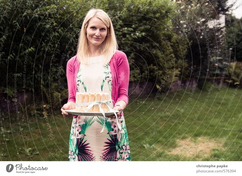 Cake? Dessert Nutrition Young woman Youth (Young adults) 1 Human being Garden Fashion Dress Blonde Smiling Fresh To hold on Presentation Birthday Birthday cake