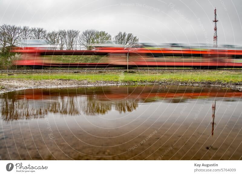 train service Train Transport Mirror effect Water reflection Puddle Rain puddle Puddles photography Track Train services railway line Surface of water