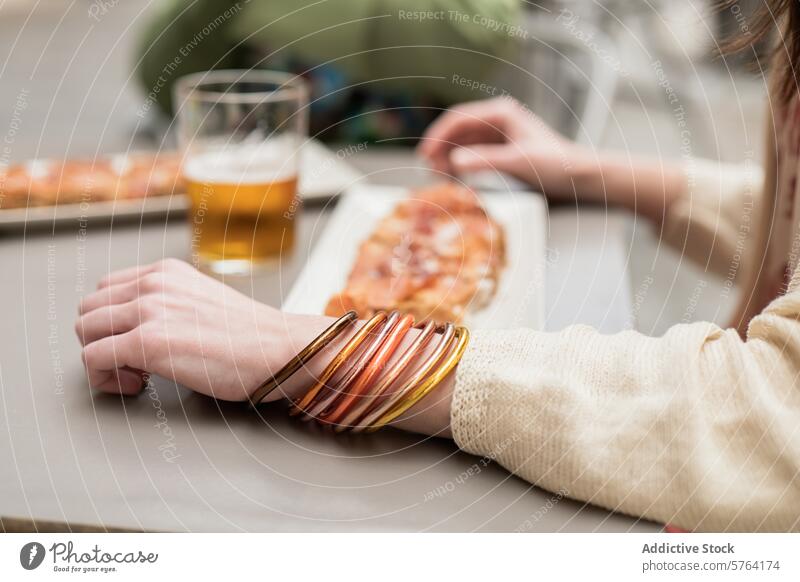 Casual dining experience with a touch of spring fashion arm bracelet casual colorful eating food glass jewelry lunch outdoor relaxation style table woman beer