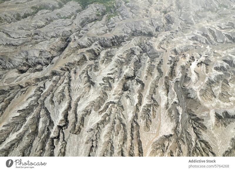 A captivating aerial perspective of the grooved terrain formed by erosion in a volcanic ash valley, displaying unique geological patterns landscape nature