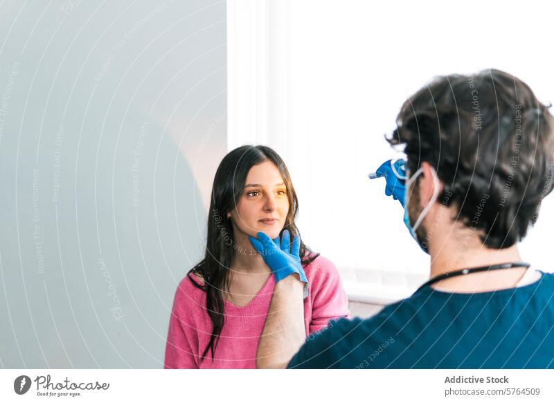 A medical professional in gloves palpates the neck of a patient, checking for swollen lymph nodes in a routine exam doctor palpating healthcare examination