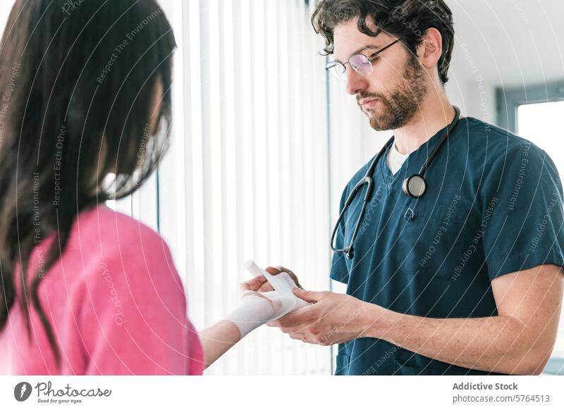 Focused image of a medical professional securing a bandage on the wrist of a patient, ensuring proper wound care wrapping injury doctor healthcare treatment
