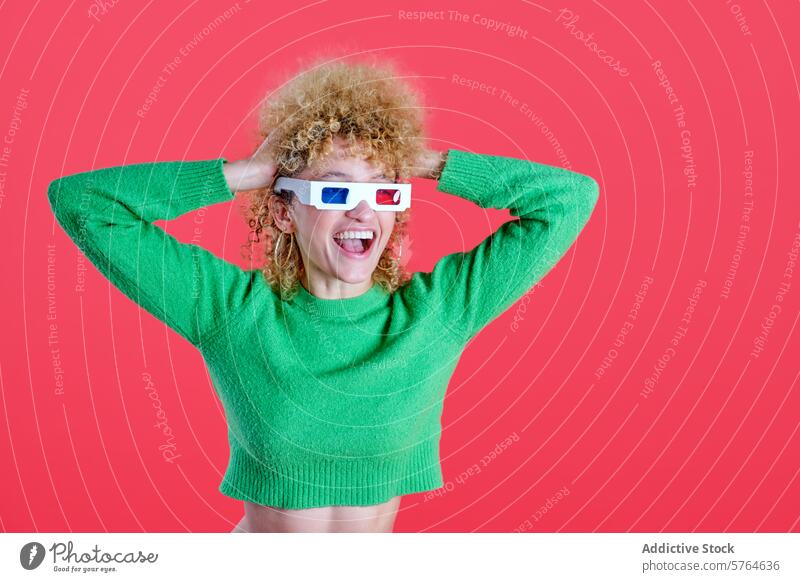 A woman with bouncy curly hair is all smiles in 3D glasses, sporting a lively green sweater against a captivating red background female joyful fashion vibrant