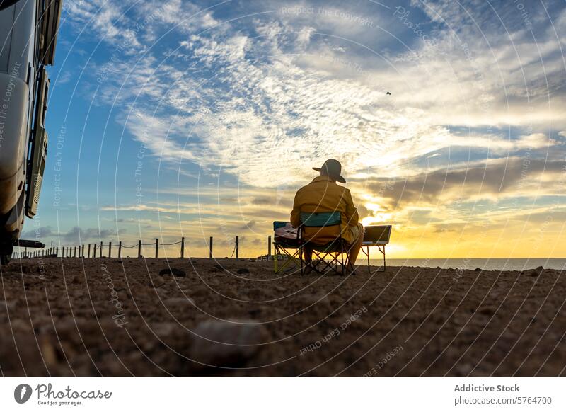 Nomadic Musician Composing by Seaside at Sunset musician nomadic sunset sea composing inspiration motorhome laptop man coastal travel lifestyle wanderlust